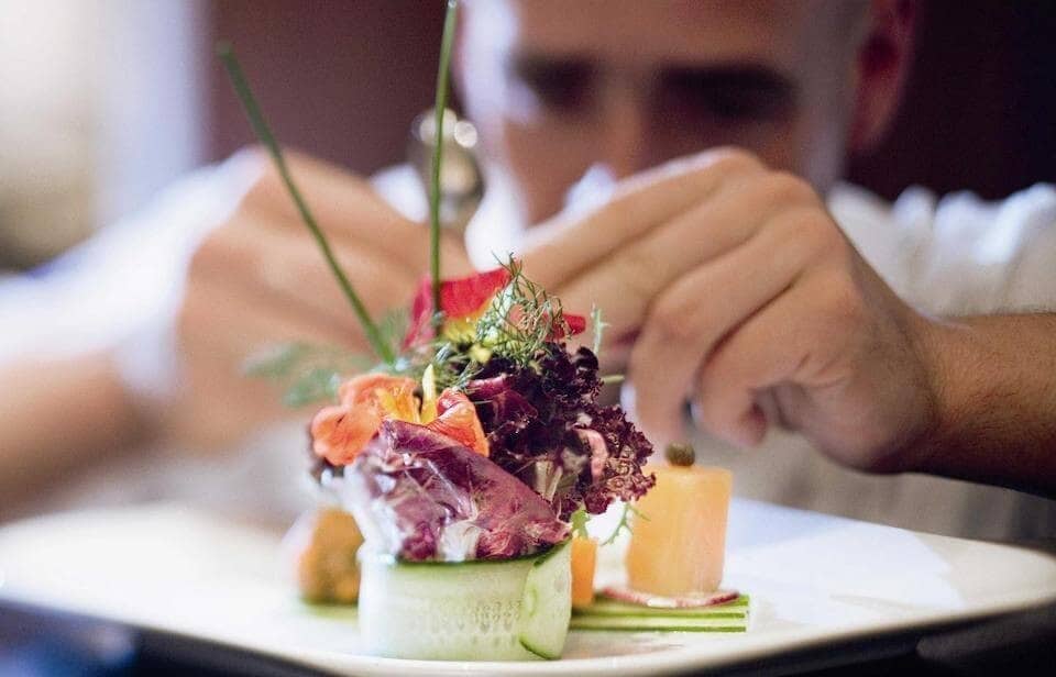 Chef dressing a plate