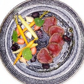 Cured venison with pickled garden vegetables, blackberries and nasturtium leaves