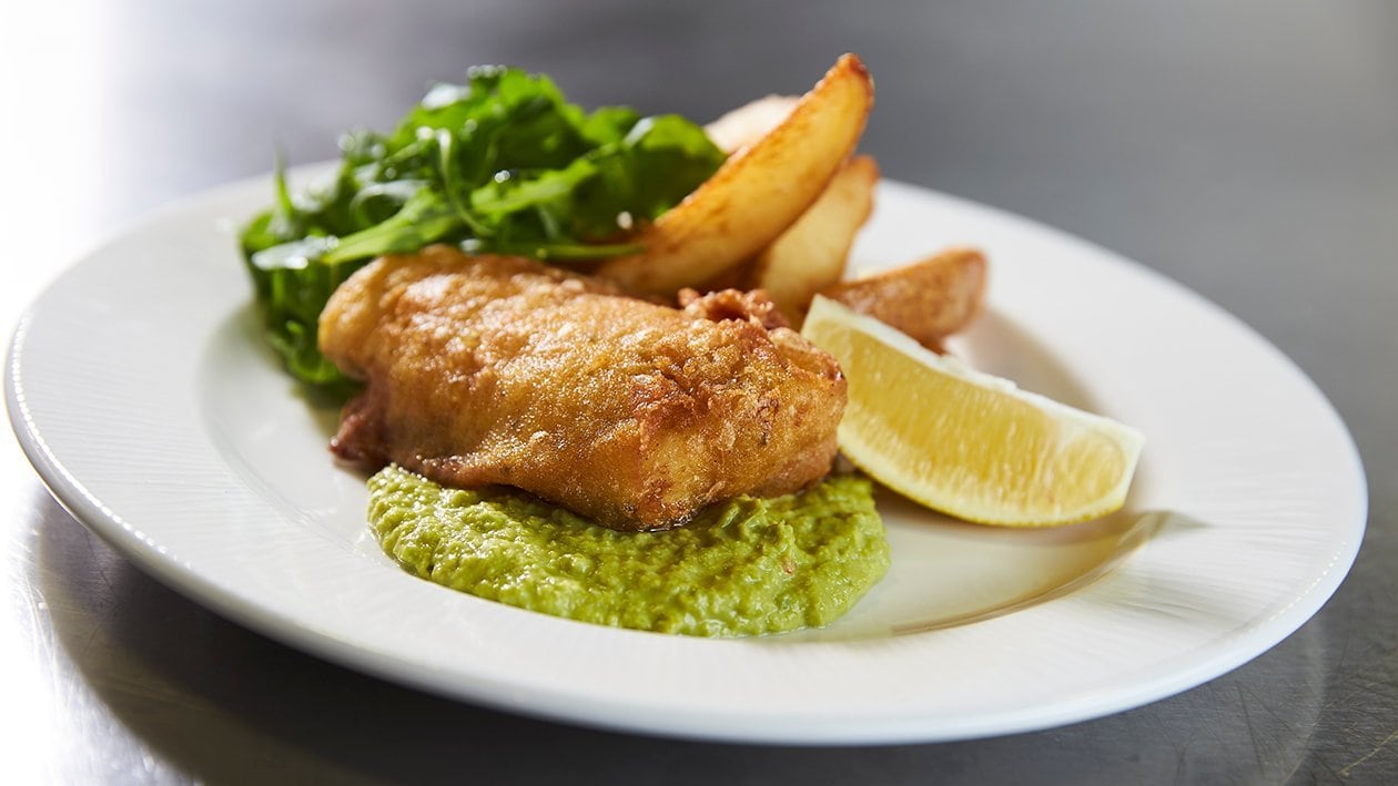 Spiced fish and chips with yoghurt pea puree – recipe