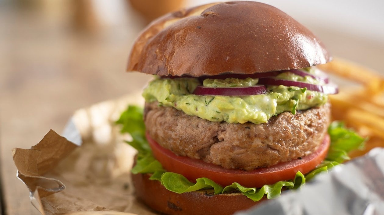 Chipotle pulled pork burger with smashed avocados & chillies – recipe